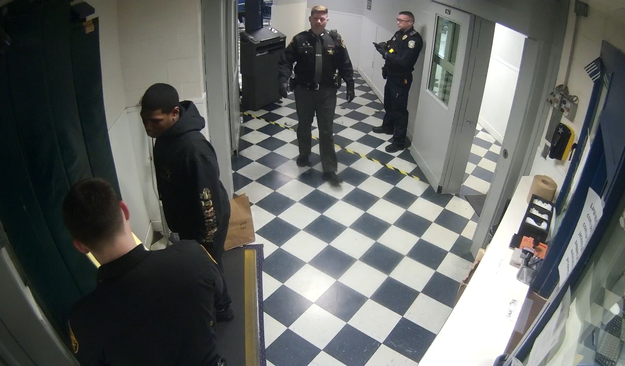 Bengals defensive back Cam Taylor-Britt being booked into the Hamilton ...