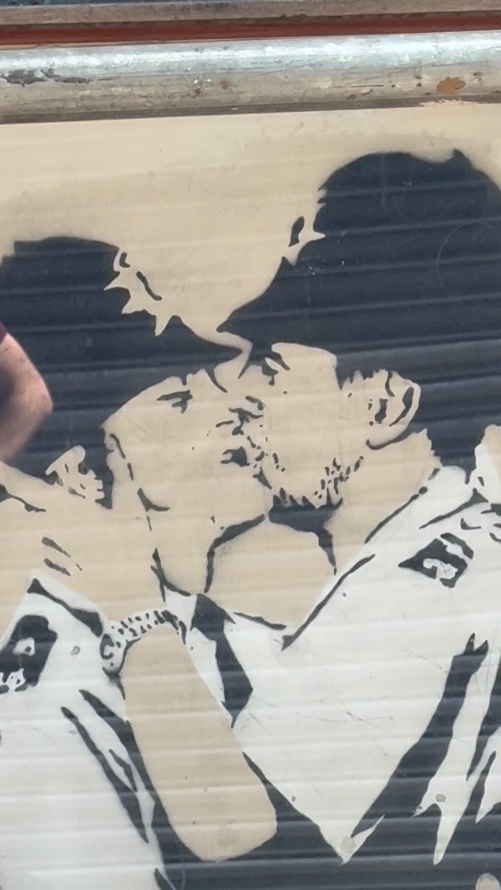 A Banksy mural in north London has been covered with plastic and