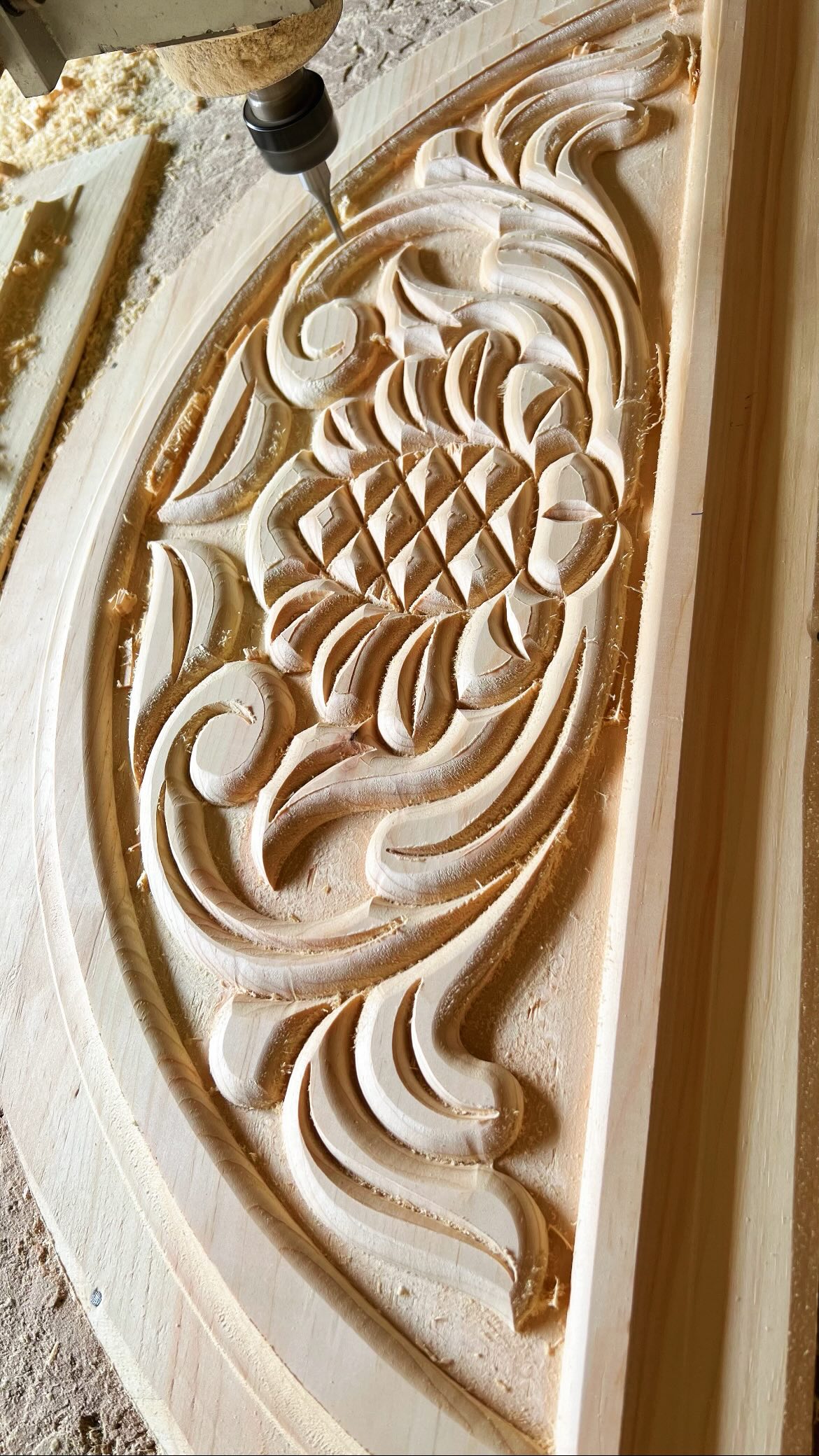 Watch a CNC router perform deep, precise carving on a wooden door ...