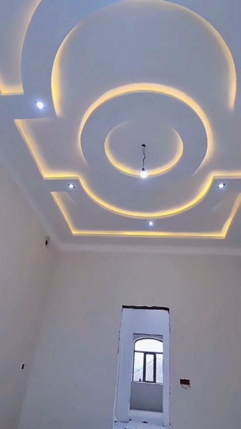 The ceiling is designed with multiple concentric circular layers at the ...