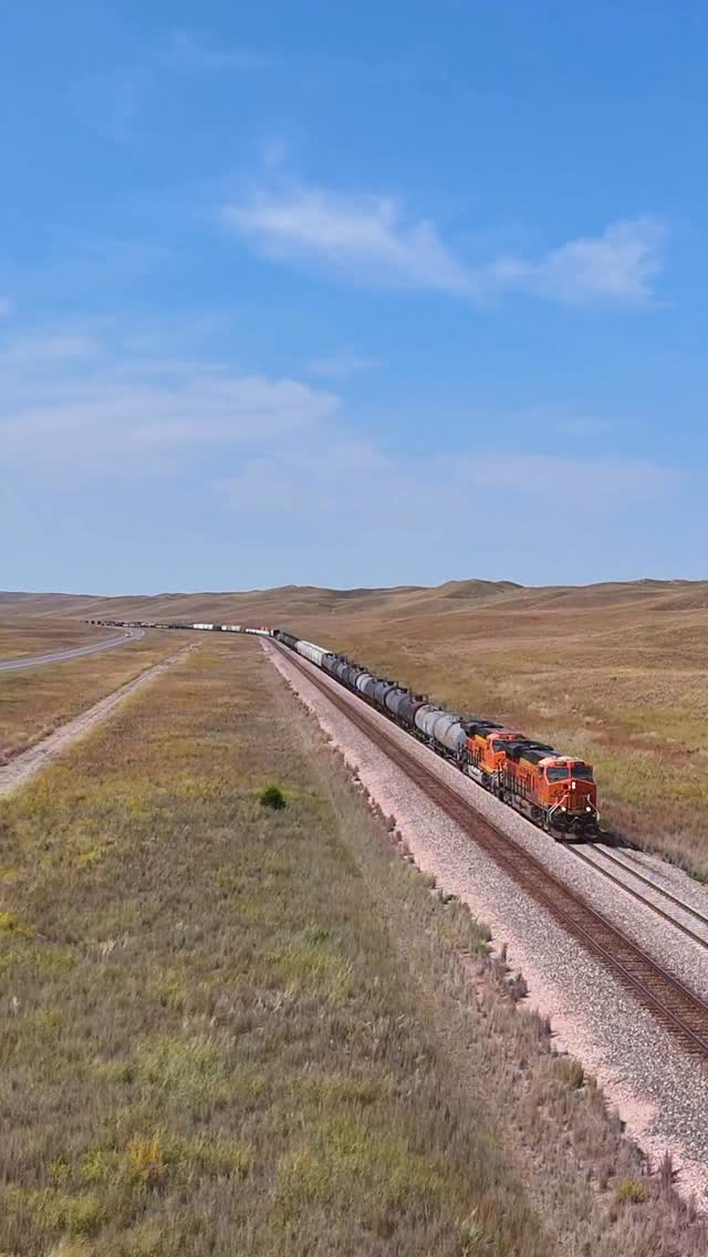 An eastbound BNSF manifest train cuts through the Sand Hills on a ...