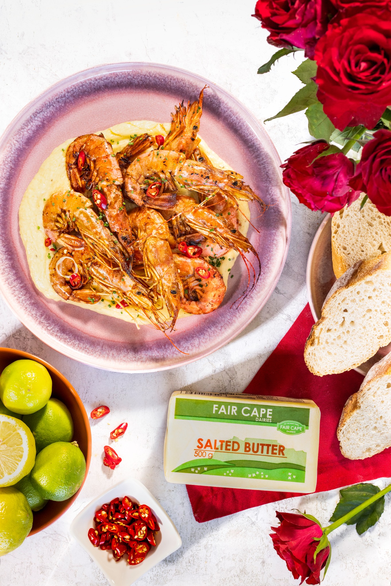 These grilled prawns, topped with a chilli butter sauce, are made to ...