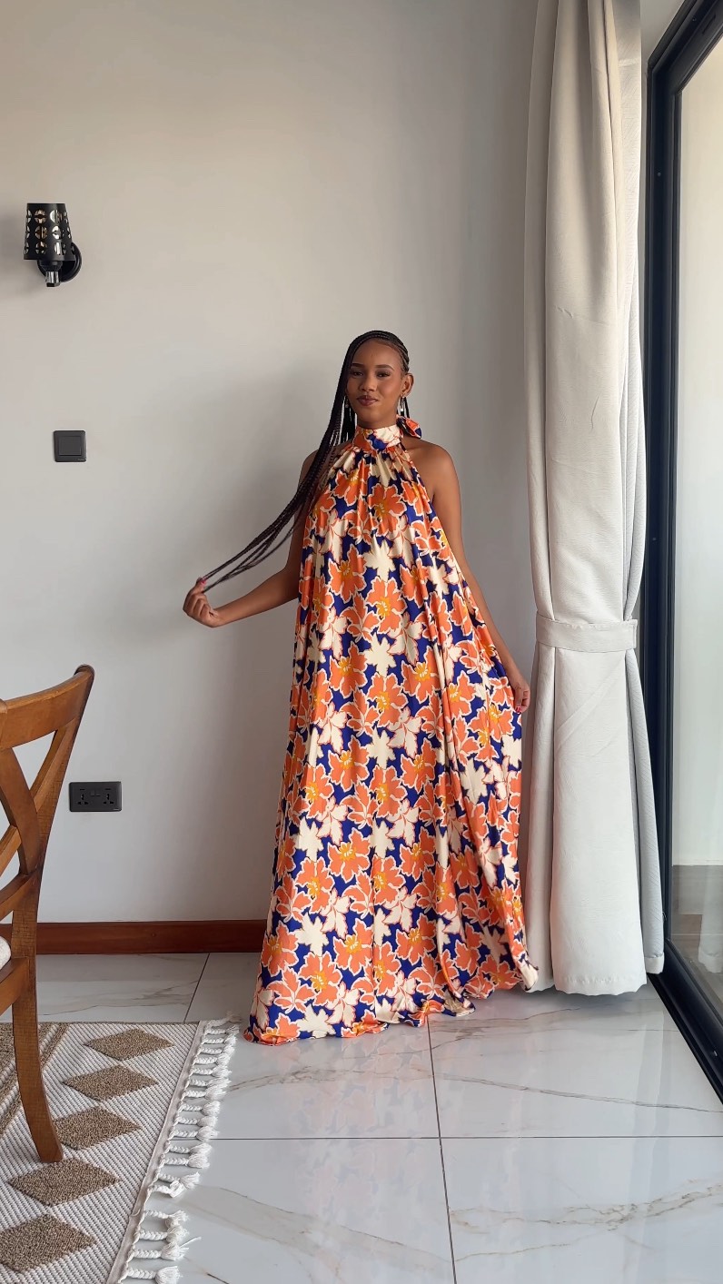 The Sunset Garden Zara Dress 🌅🌸 — where bold florals meet effortless femininity., A flowy maxi silhouette, flattering halter neckline, and pockets because beautiful and practical should always go 