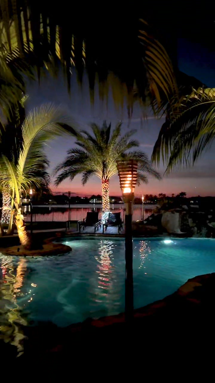 Our pools shine bright at night.This tropical backyard oasis in Weston ...