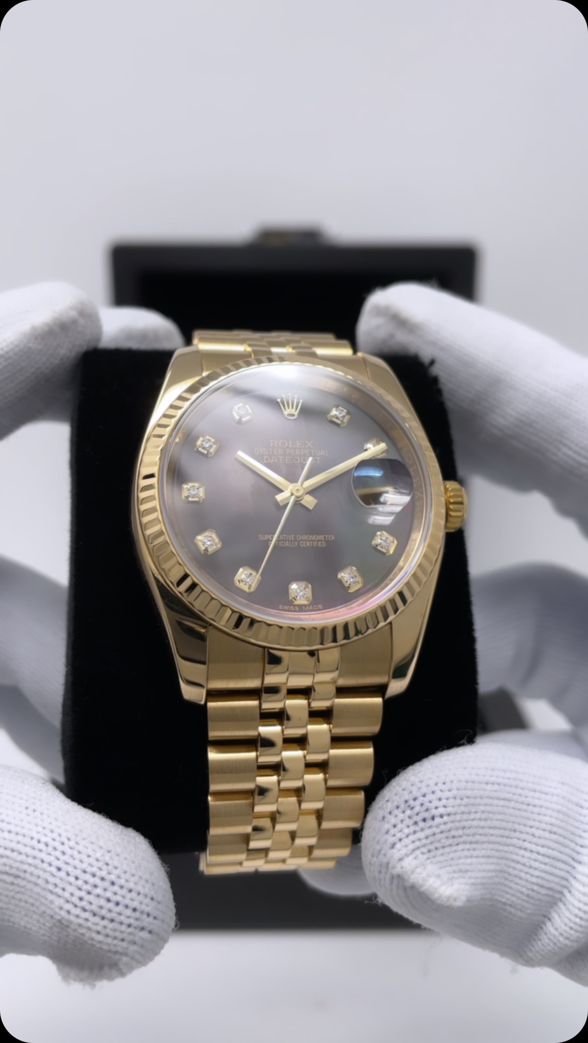 All yellow gold Rolex Datejust 36 116238 watch with the black