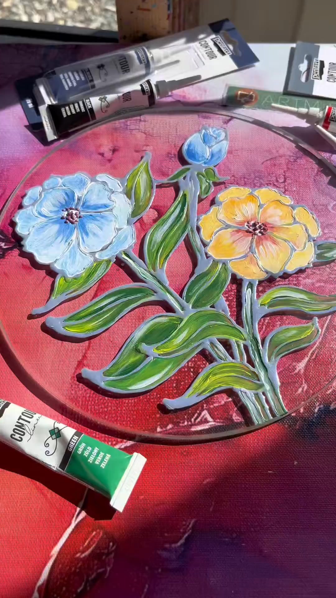 Glass painting with liners and acrylics that creates a stained-glass ...