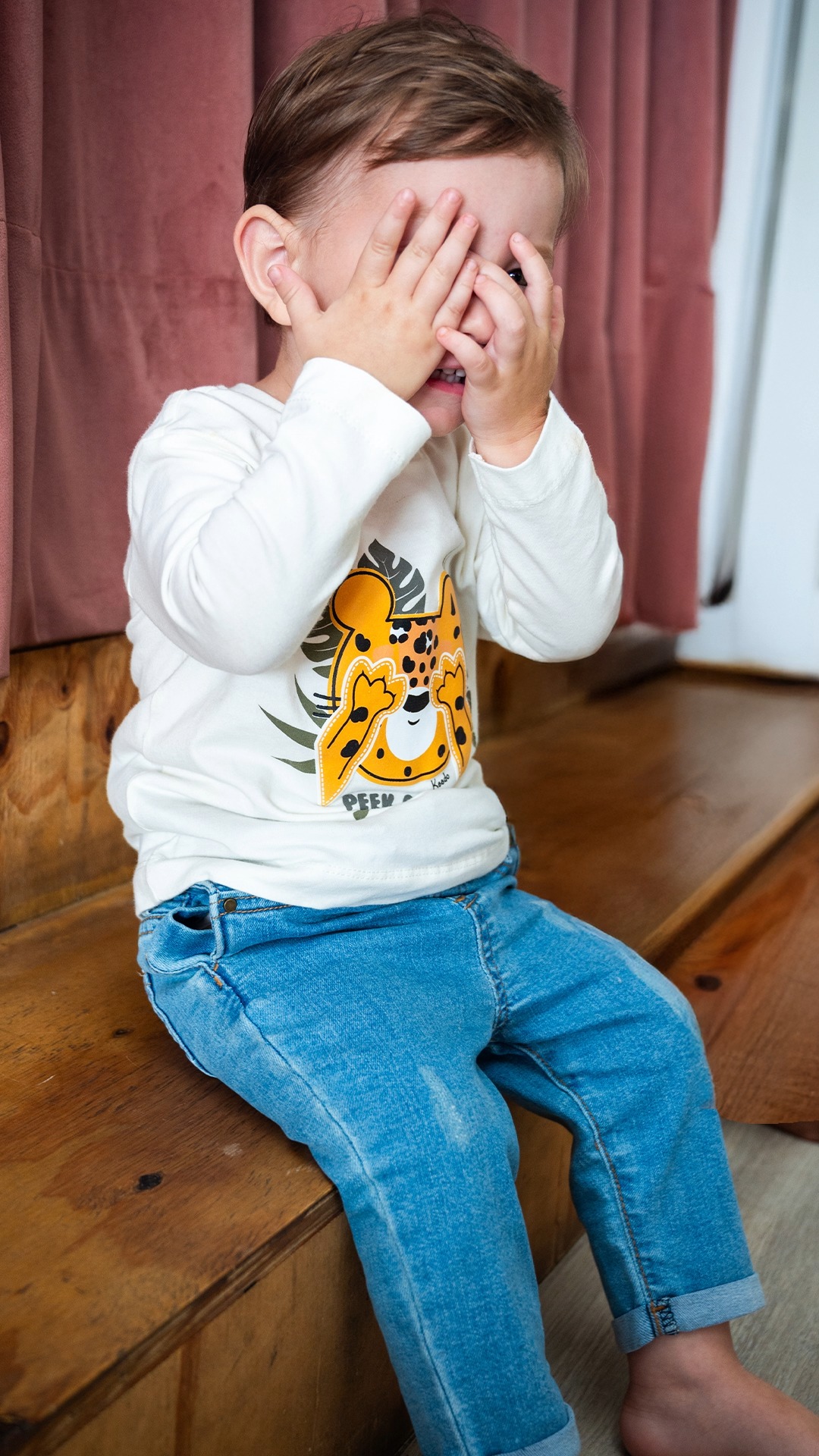 Peek-a-boo perfection 👶🏻💛 When the tee says it all and the smile seals ...