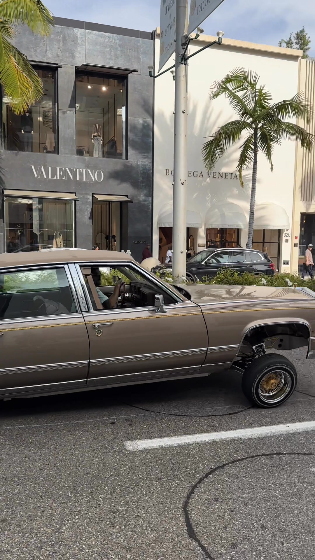 A classic Cadillac lowrider glided down Rodeo Drive, bringing vintage ...