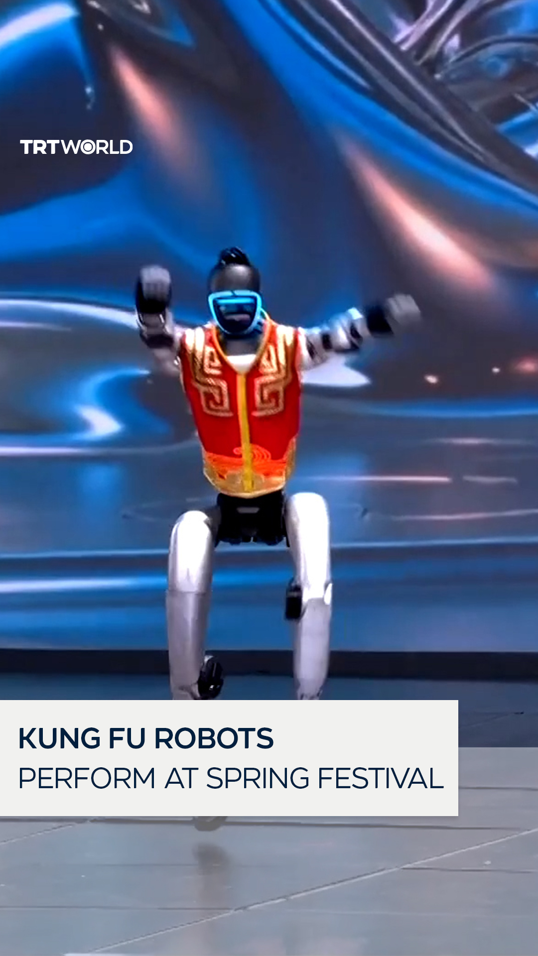 Humanoid robots performed alongside young Kung Fu artists in a martial ...