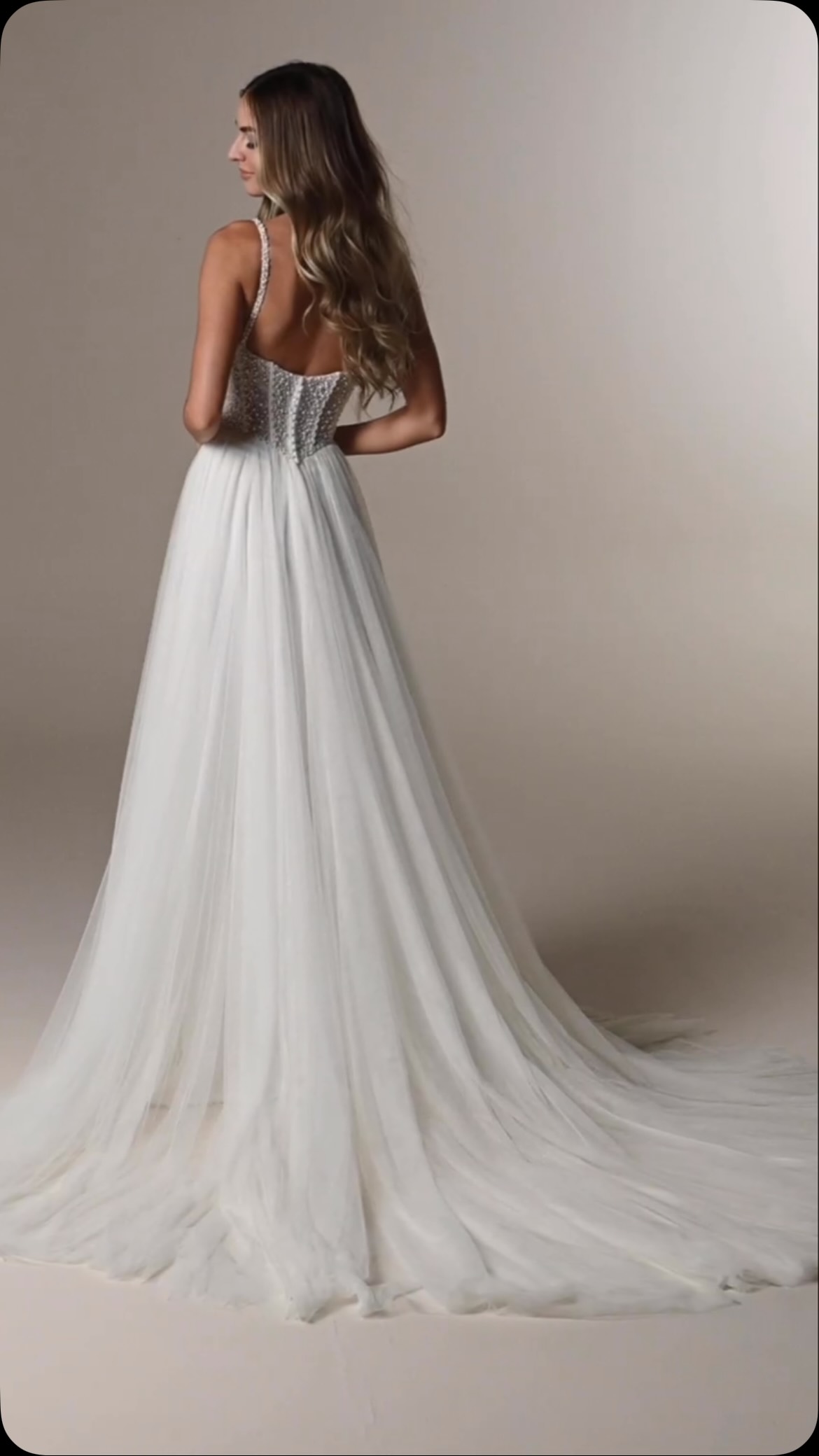 Sheer pearl tulle A-line bridal dress with a slit 💕 Maggie Sottero Designs