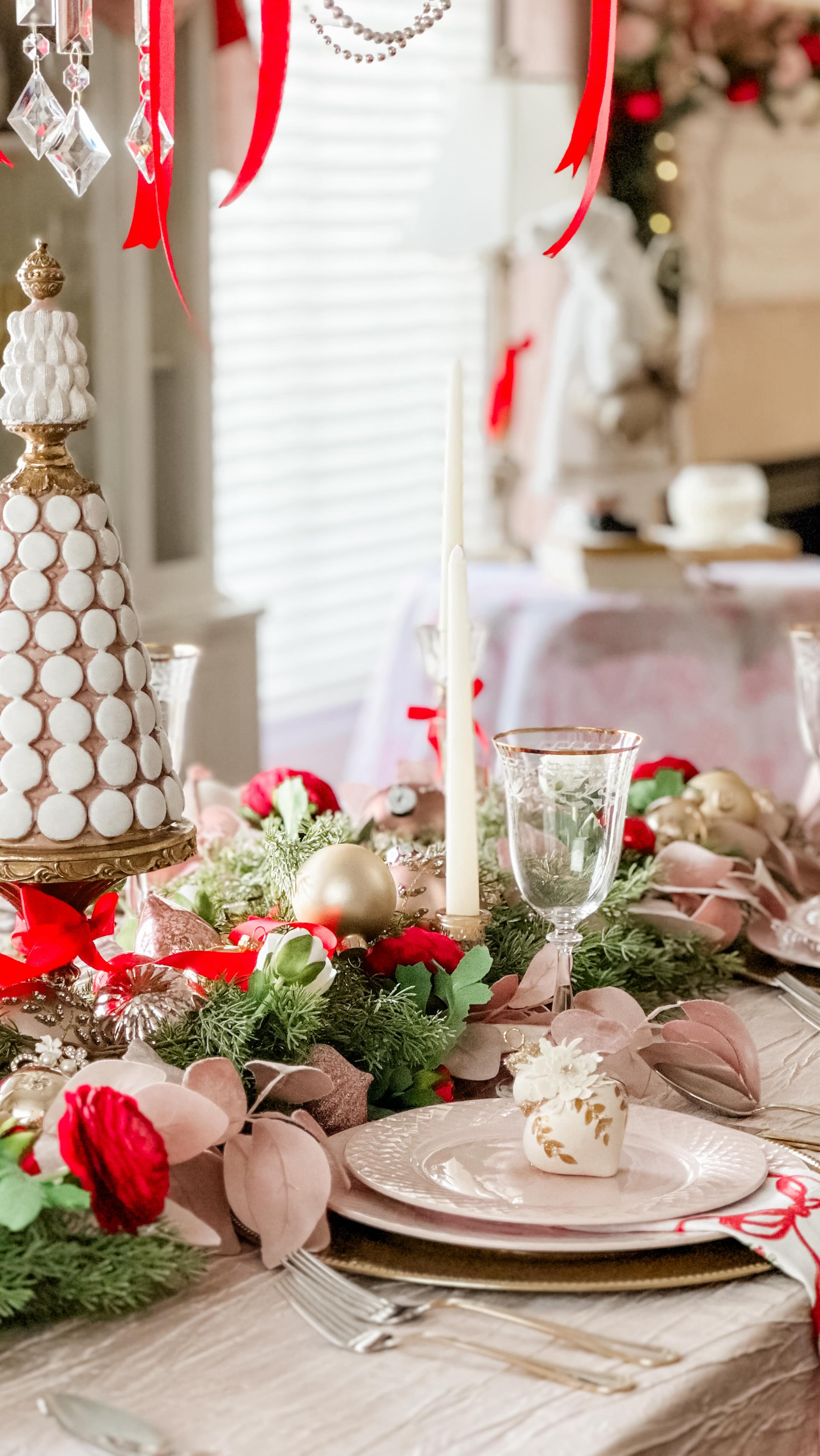 A Christmas table dressed in romance, where soft pinks meet festive ...