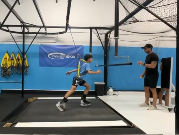Skating at speed while catching and throwing tennis balls with the same ...