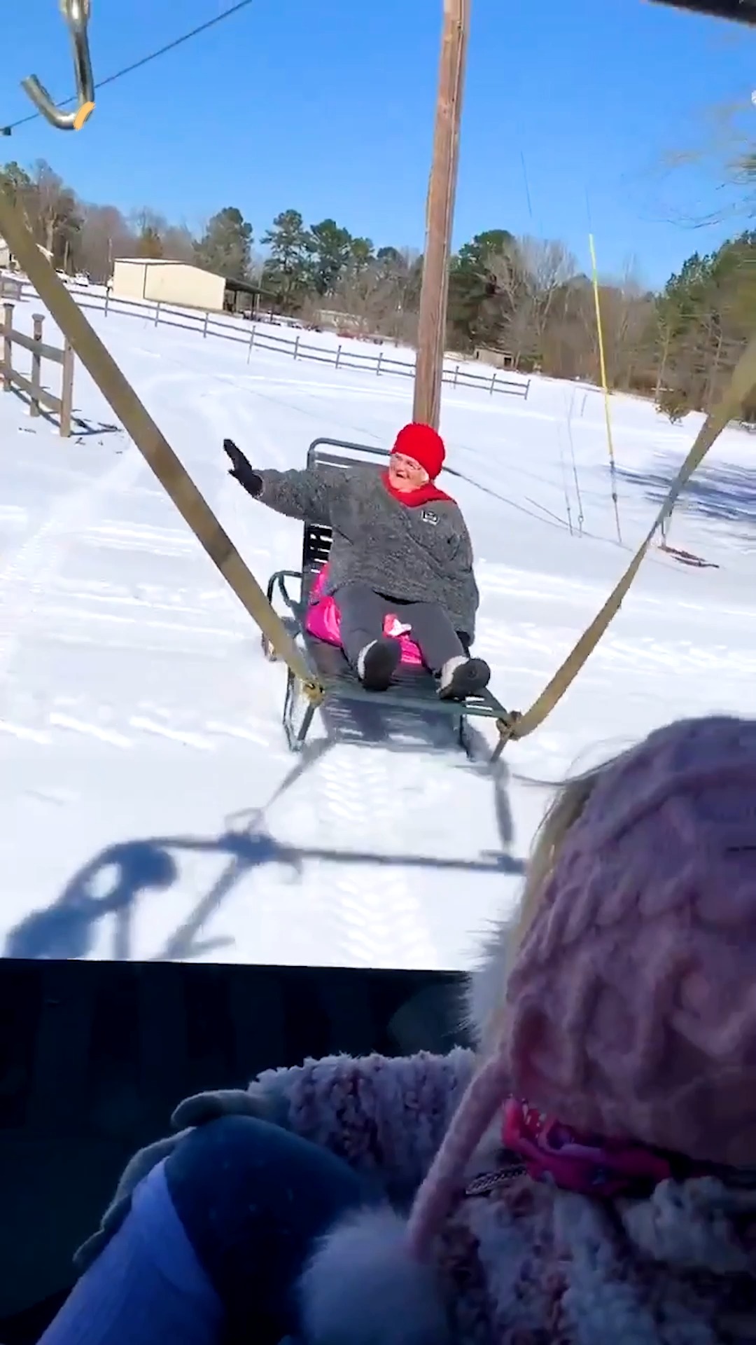 Excited Granny Enjoys Snow With Family While Riding Lounge Chair Sled ...