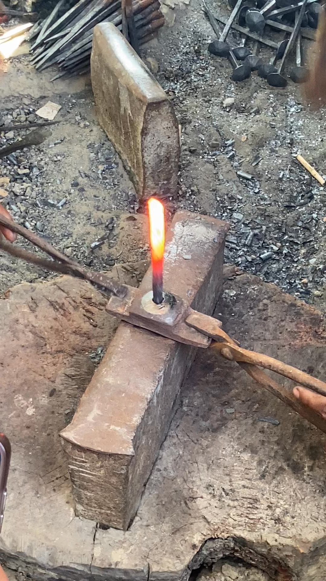 A Bangladeshi blacksmith shaping iron with sweat, fire, and dedication ...