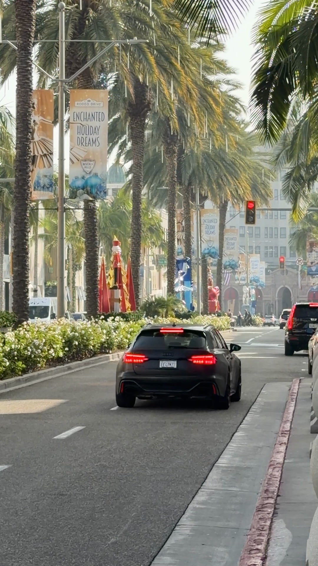 An Audi RS6 Avant makes a clean U-turn on Rodeo Drive, blending ...