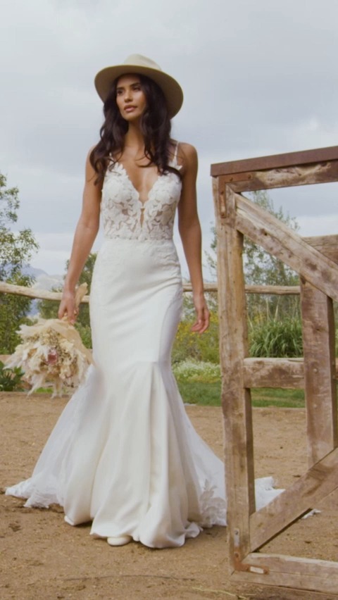 The Madison James MJ861 'Kalani' pairs breezy cotton lace with a luxe stretch crepe and illusion netting for the train. | Ferrari Formalwear & Bridal