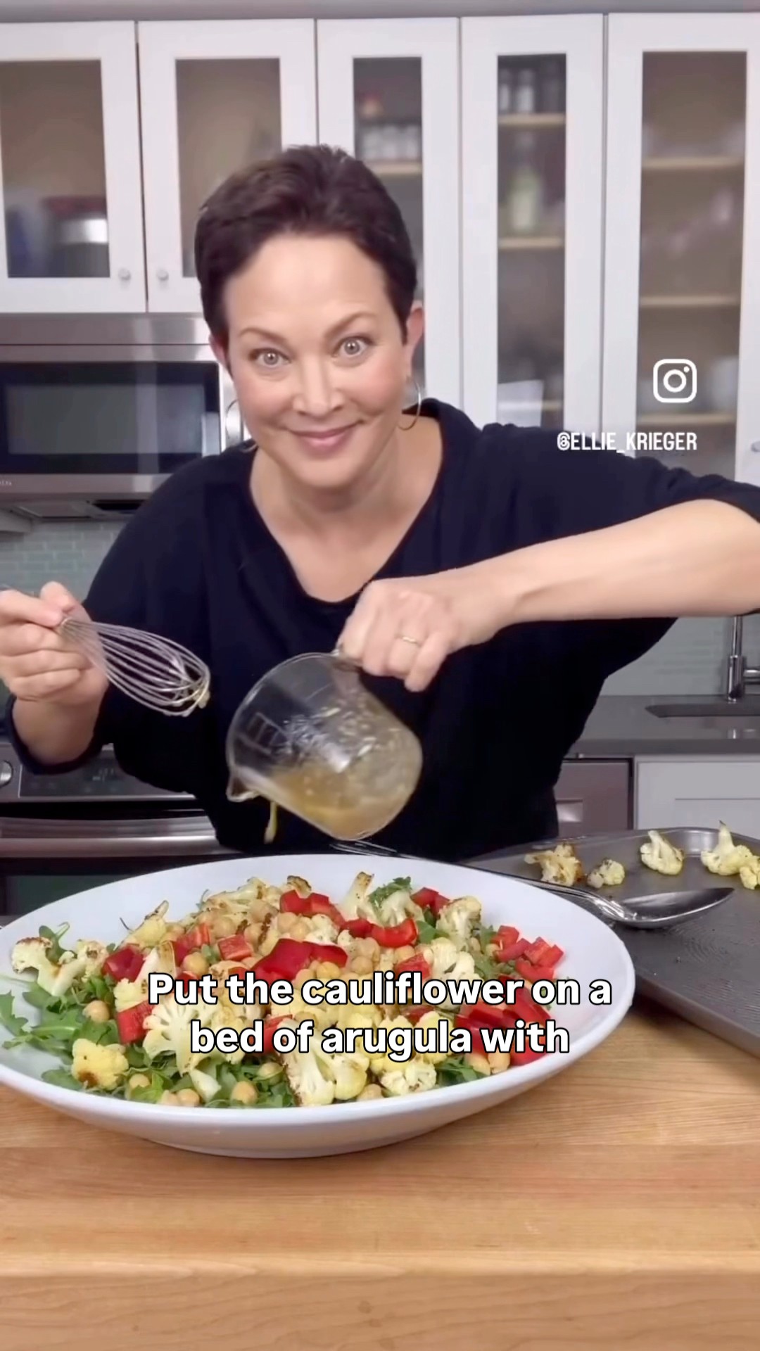 A mix of cooked and raw ingredients in this colorful roasted cauliflower salad-- all married in a bright, roasted garlic vinaigrette-- play off one another deliciously. Get the recipe in the comment 