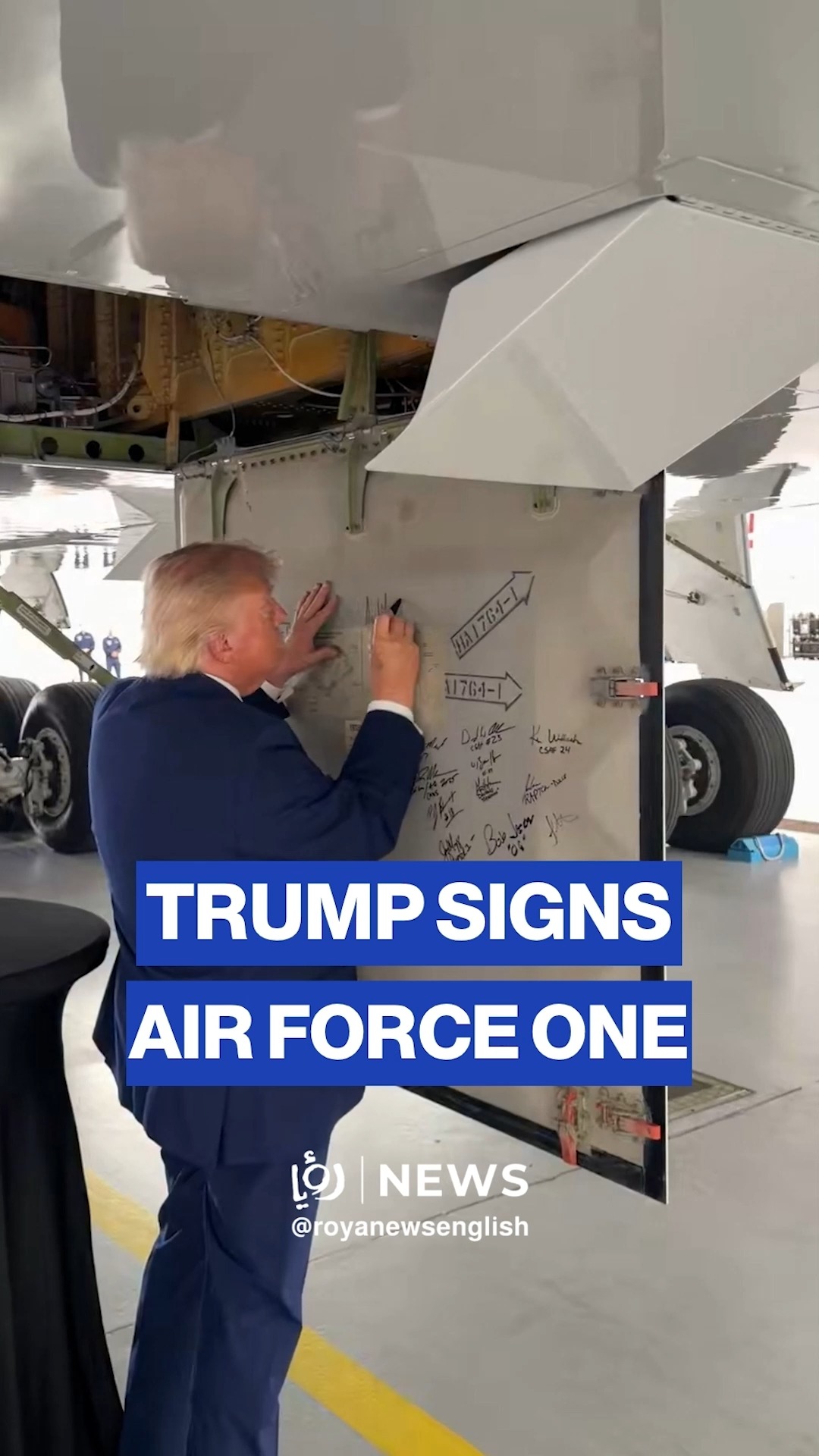 President Trump signs the mechanical panel of the new Air Force One.