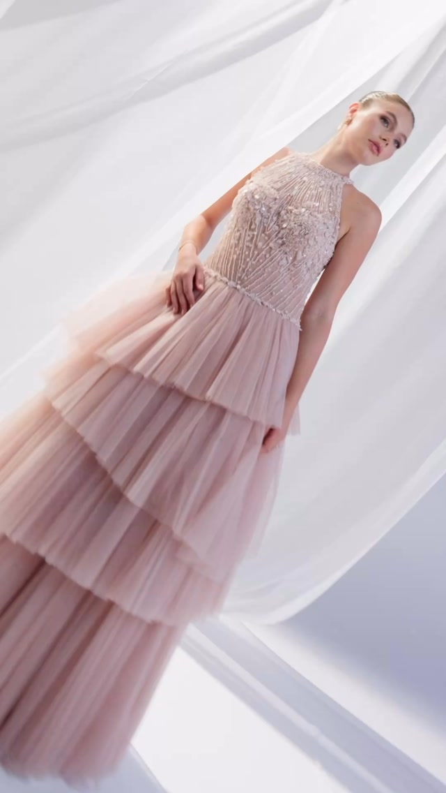 blush halter wedding dress Ethereal romance in soft ✨, This halter-neck masterpiece features an intricately beaded and embroidered bodice cascading into a voluminous multi-tiered tulle skirt. Soft, romantic, and utterly elegant halter neck wedding dress