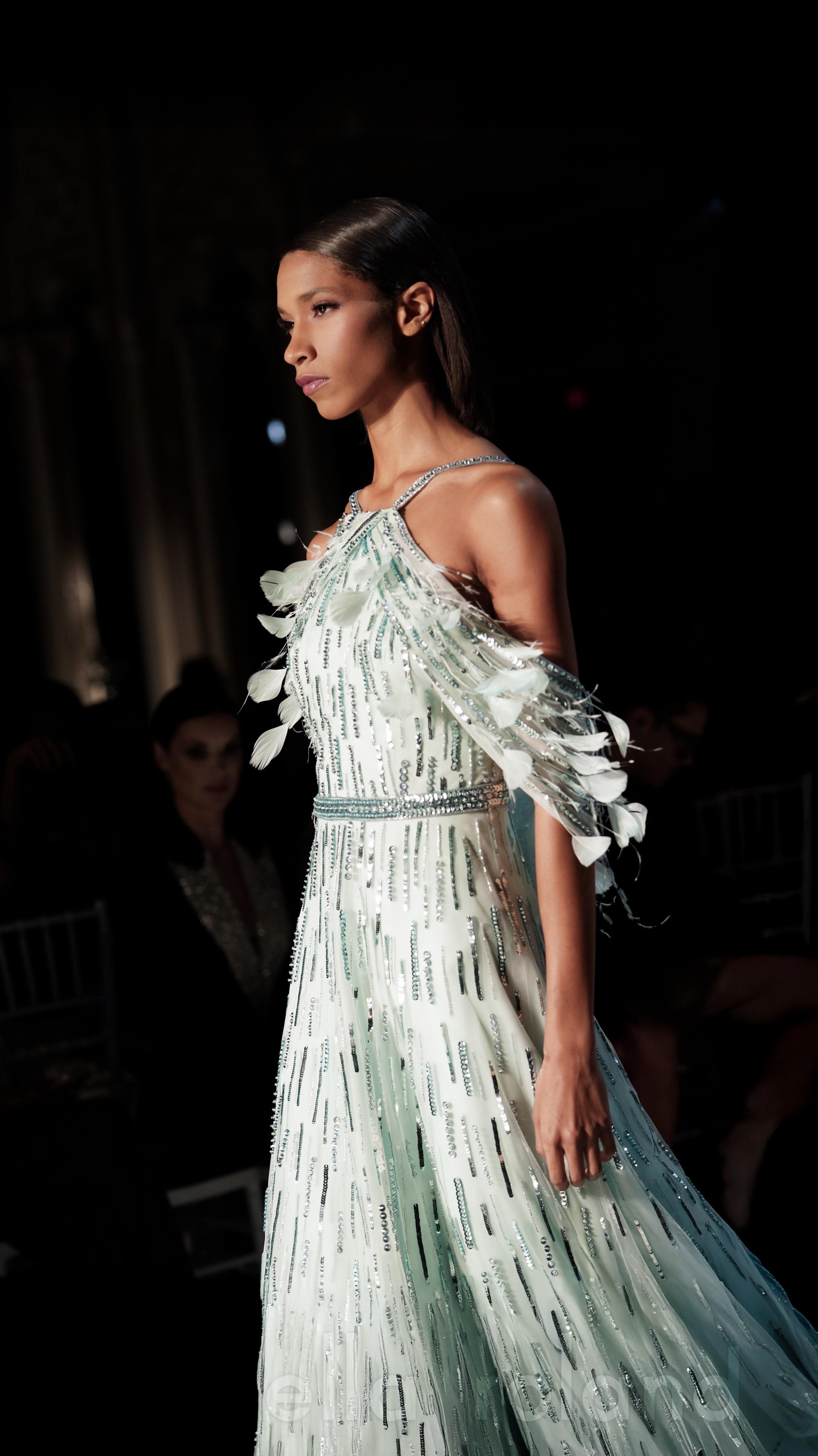 layers paris dress of sequin and feather embroidery create a sense of movement and light across our pink halter gown, displaying artistry in motion for market week. Discover our latest collection at pamellaroland.com Layering Essential