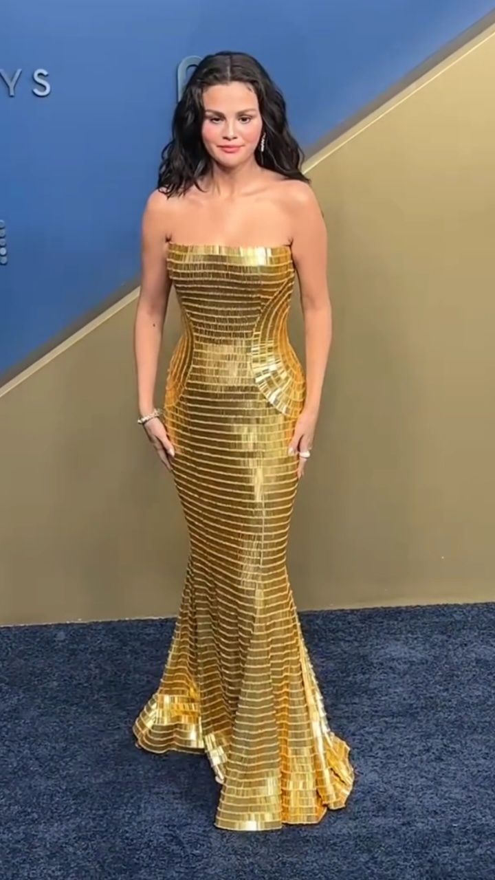 celebrity gold dress ✨ Selena Gomez shines in at the 78th Primetime Emmys! ✨, 👉More style inspiration on our YouTube channel🔗: https://youtu.be/5ofzcFQUGhY?si=PNy-VwkYS-AKrSos, #FashionasaLifestyle holiday party
