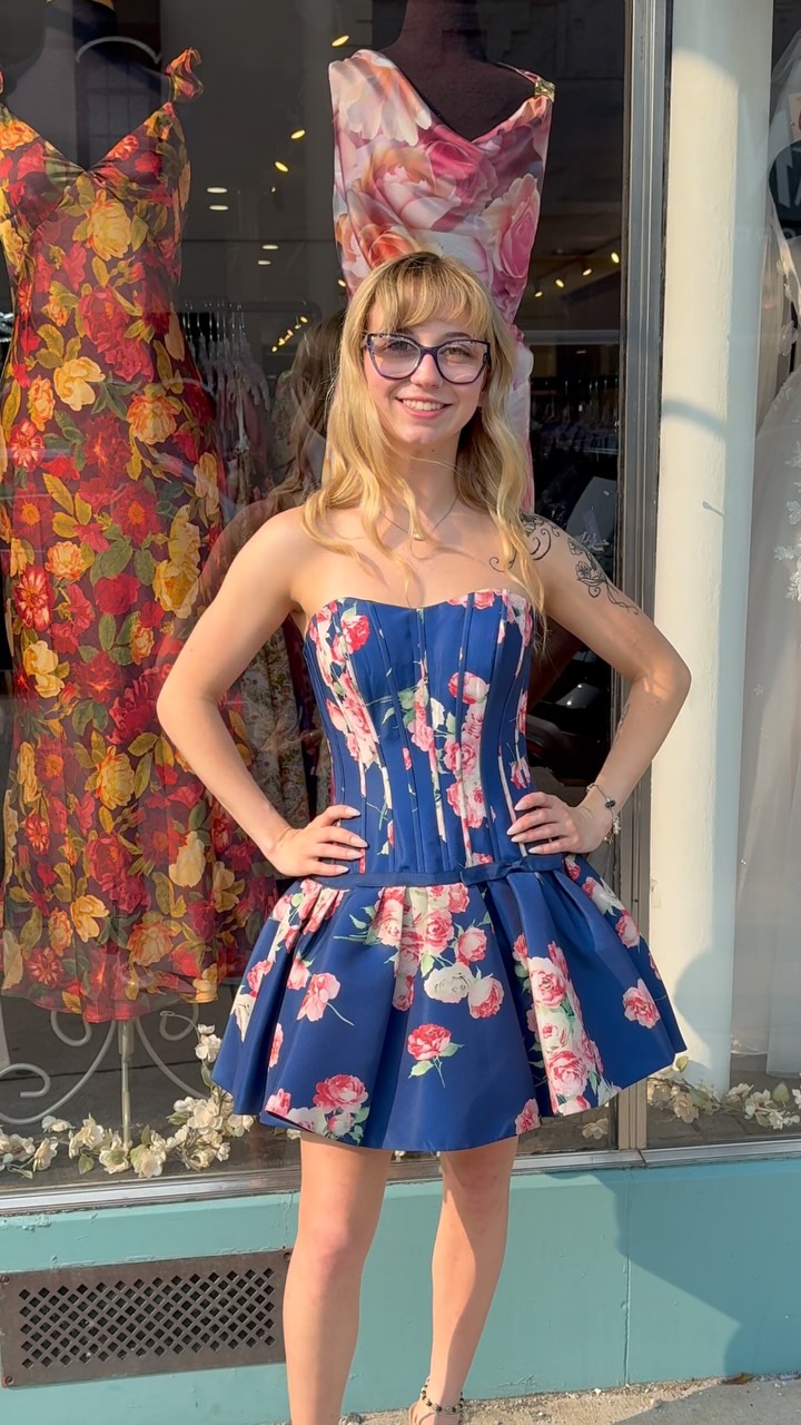Navy, flowers, and a sweet little bow from Sherri Hill in store now 👗 | Lex's Of Carytown