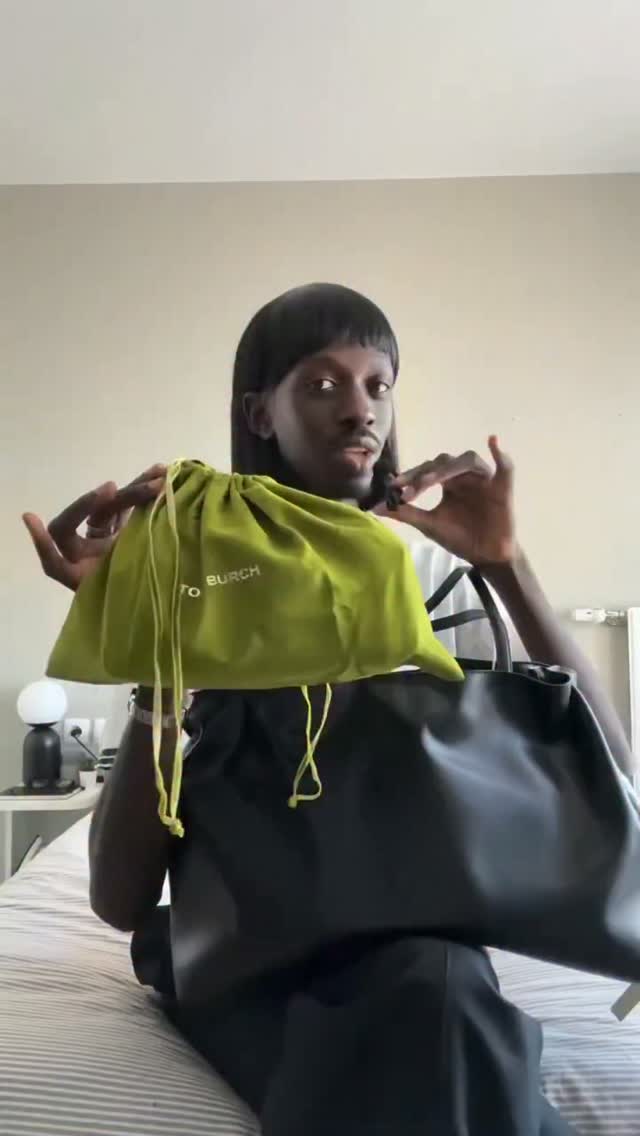 Très chic. @itsniane unboxes his Tory Burch bag within a bag