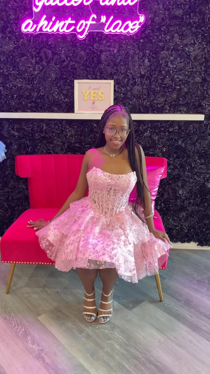 Homecoming dress try-on at Glitter and Lace Formal Dress Boutique