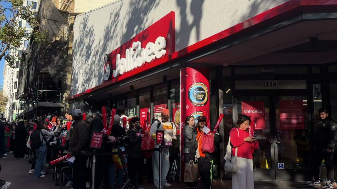 Customers line up for the Jollibee opening in downtown San