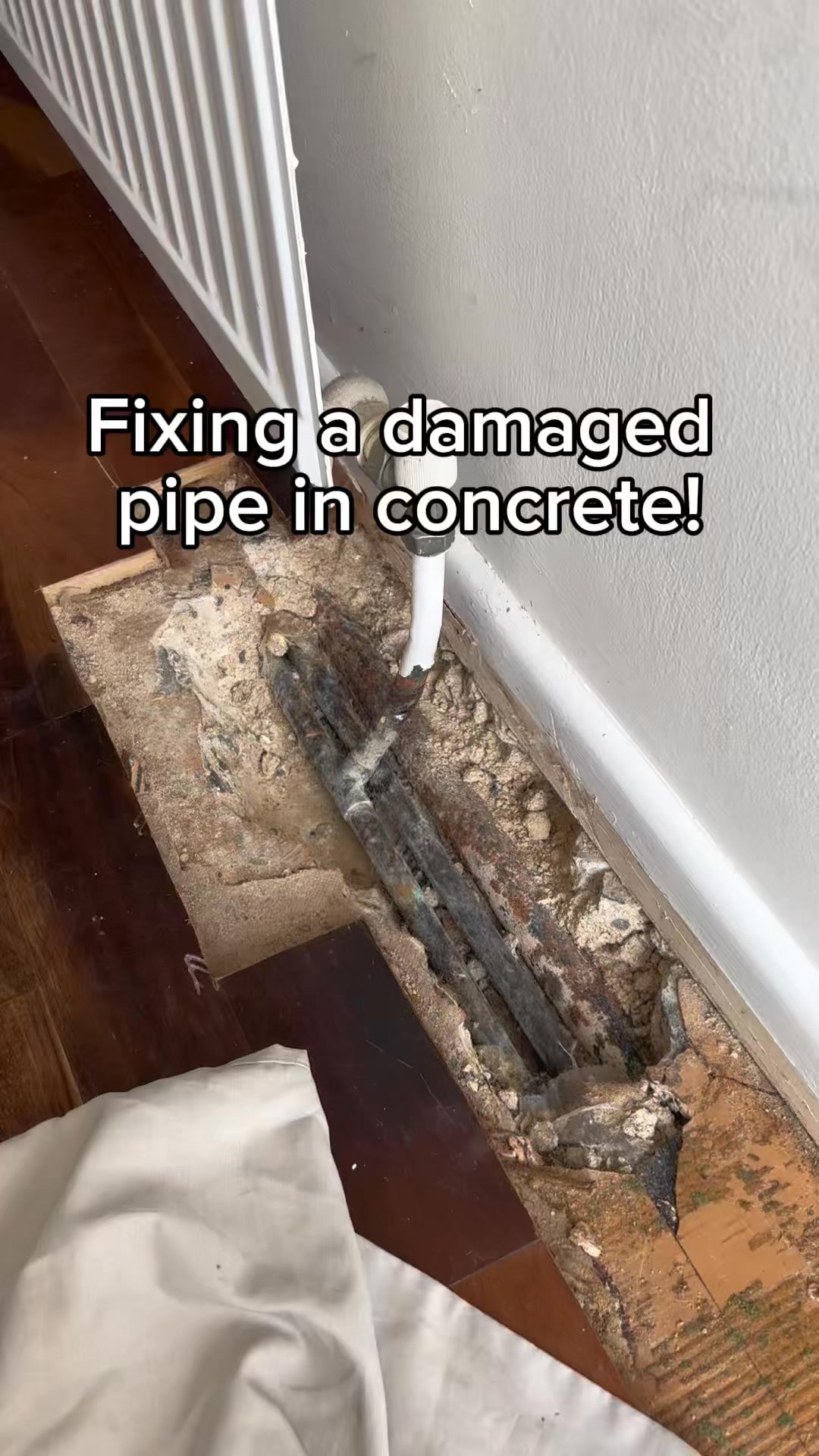 Pipe buried in concrete, tight to the wall, feeding a radiator. Had to ...