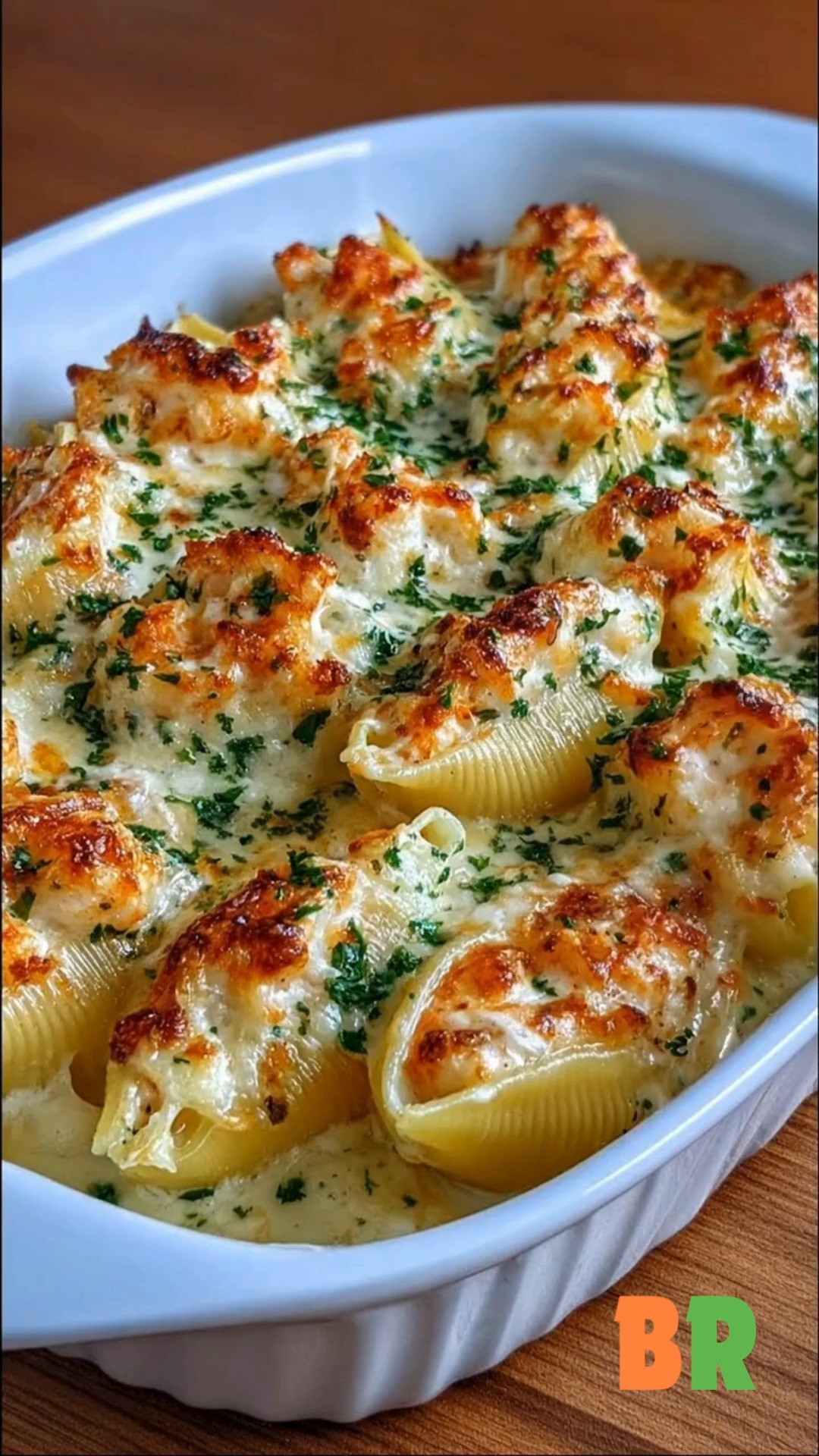 Creamy Shrimp Alfredo Stuffed Shells 🧀🍤 A porcelain-white cascade of ...