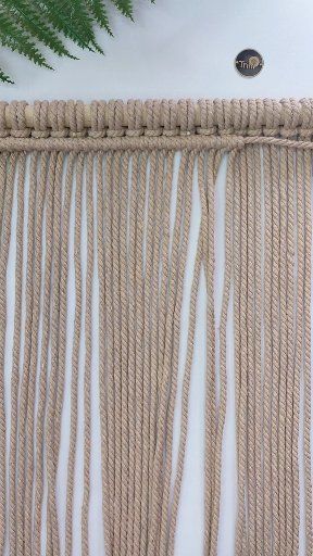 Tying a macrame double half hitch knot with long cords requires a bit ...