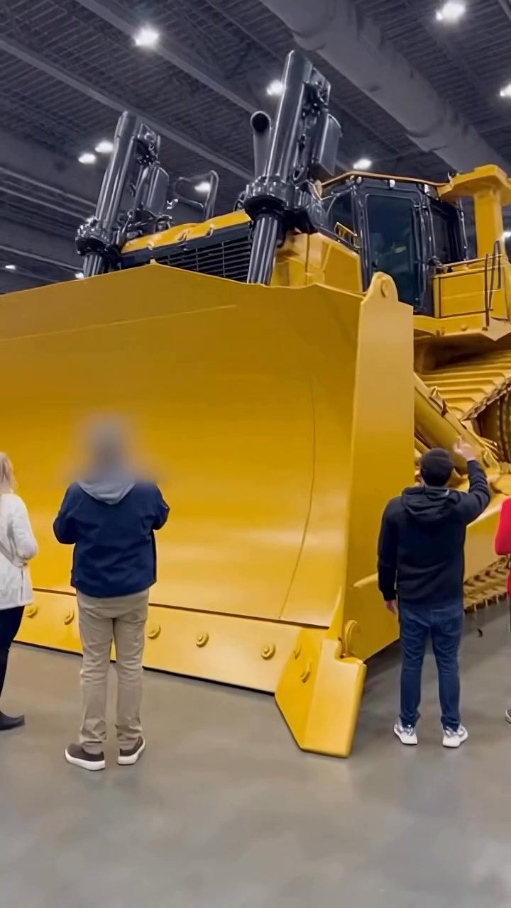 The sheer scale of this CAT bulldozer is mind-blowing! 🚜 Seeing it in ...