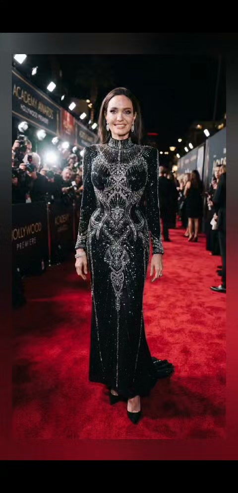 angelina jolie leather dress looks absolutely stunning and elegant in this Tom Ford ensemble.😍😍 She paired it with patent Vertigo ankle-strap pumps dusty blue ruffle chiffon dress