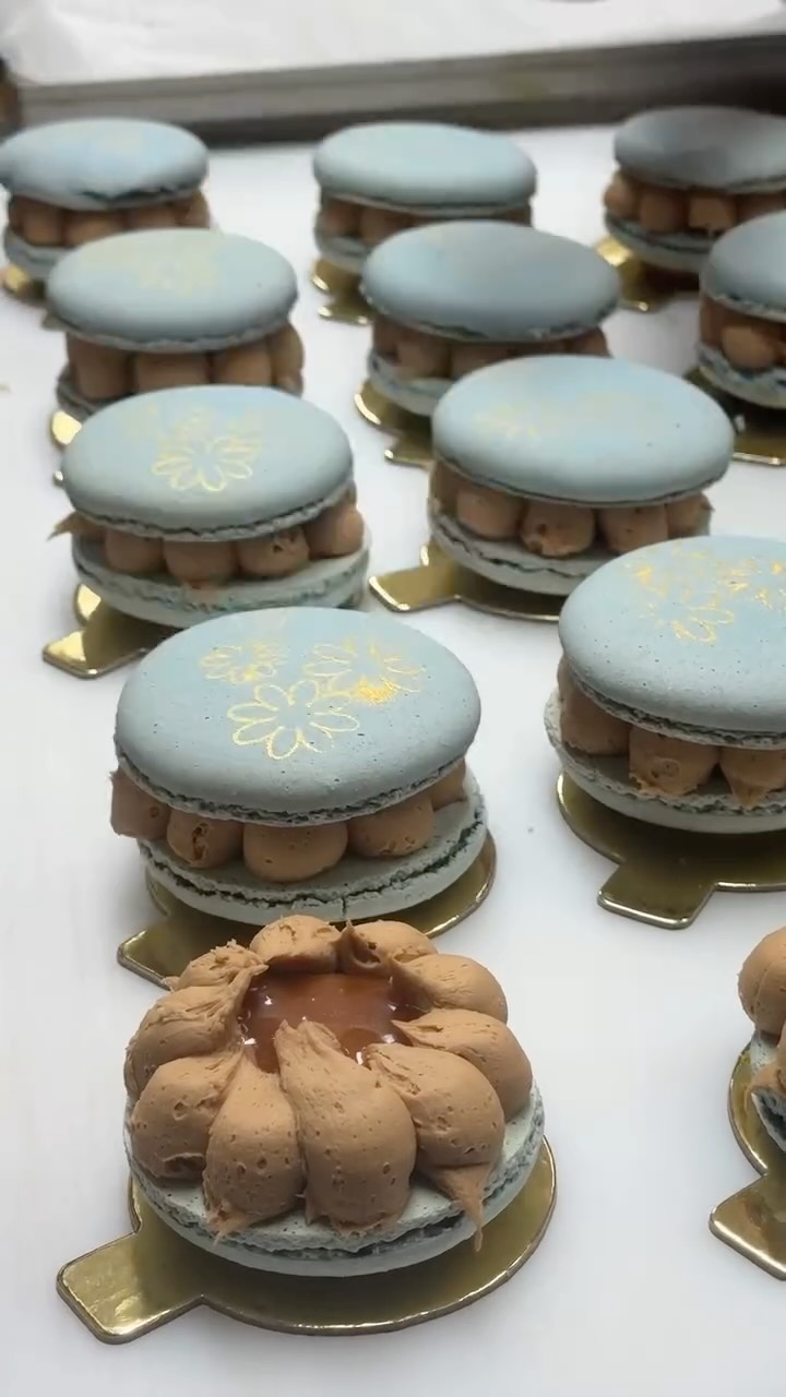 The prettiest bite of spring. Baby-blue macaron shells filled with ...