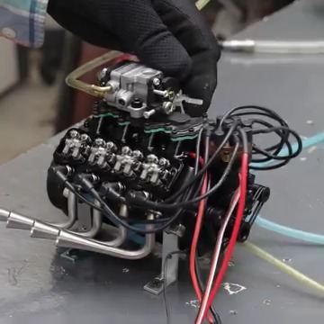 Slow Motion Close-Up of the Mini V-8 engine Rocker Arms and valve ...