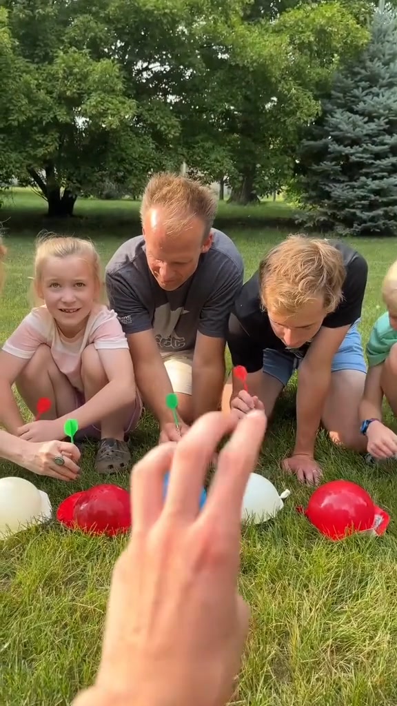 Kids and family play roulette water balloon yard game for prizes and a ...
