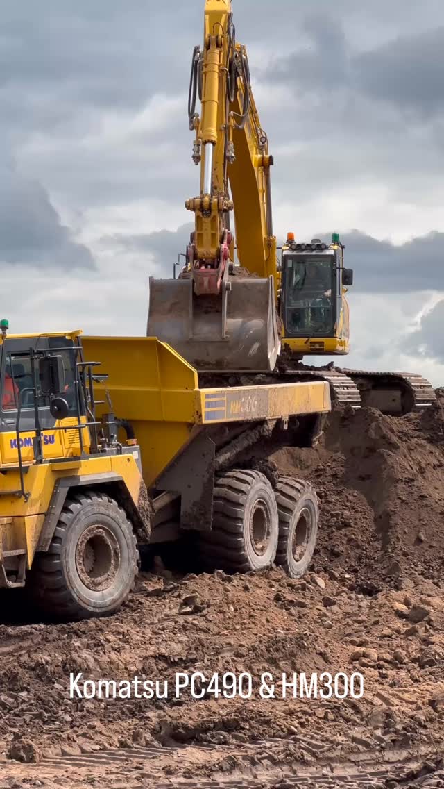 Komatsu PC490 loading a HM300 truck with material in a sand and gravel ...