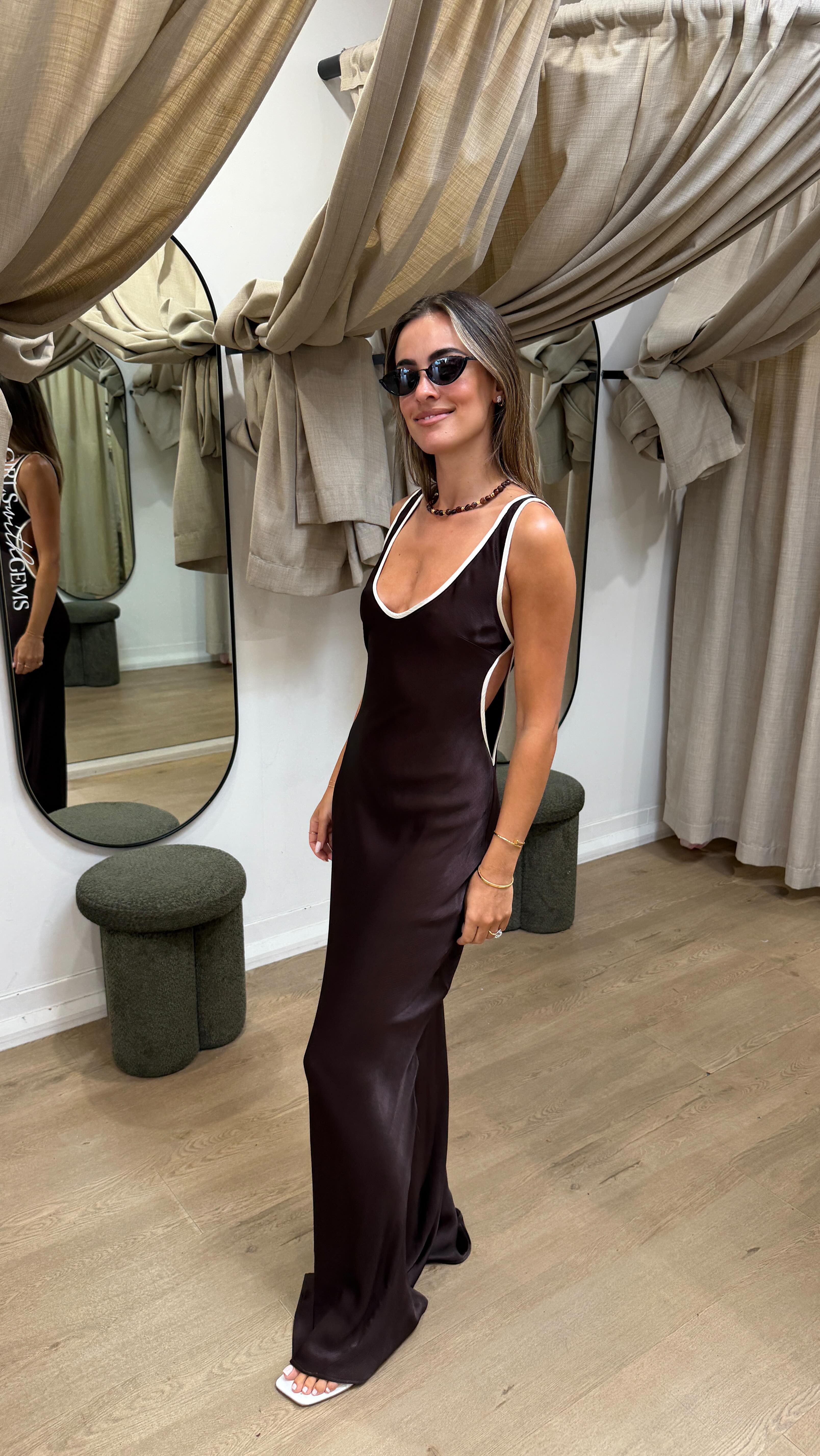 Bec + Bridge simply don’t miss 🤎🙈 The Marcy Cut Out Maxi is your next special-event go-to, featuring contrast white piping on the most divine chocolate silk. Such a moment | Girls With Gems