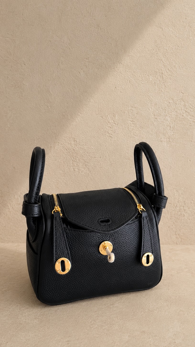 Meet our new Iris black tote in a larger size with a 16” padded
