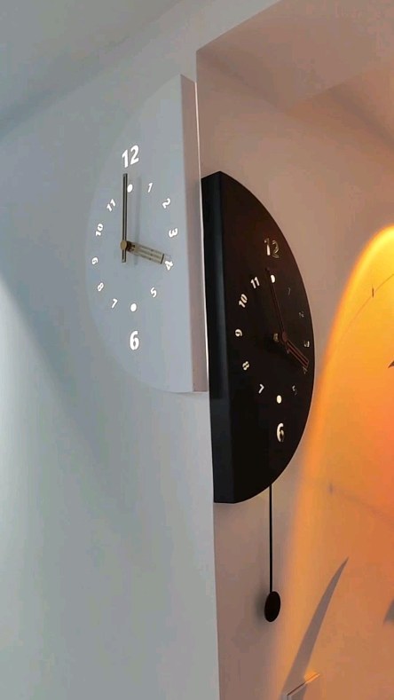 A unique and eye-catching half-circle clock designed with two pieces ...
