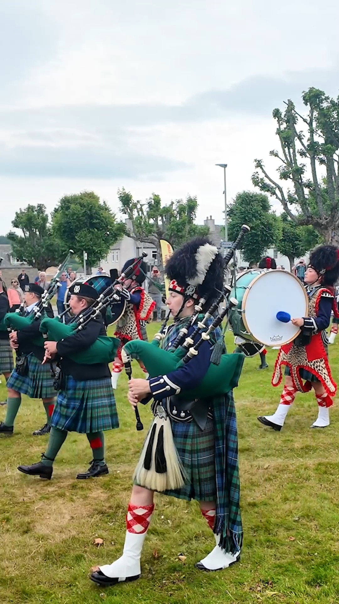 Drum Major Ian Essen leads Ballater Pipe Band as they march in to start ...