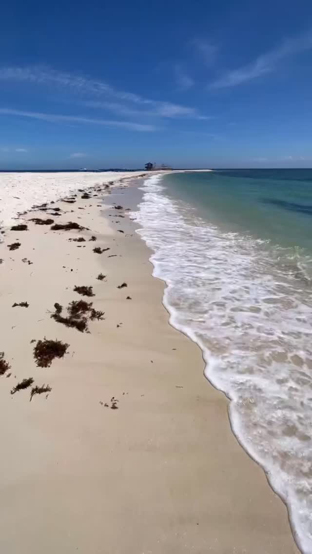 Soft white sand, clear coastal waters and the gentle rhythm of the sea ...
