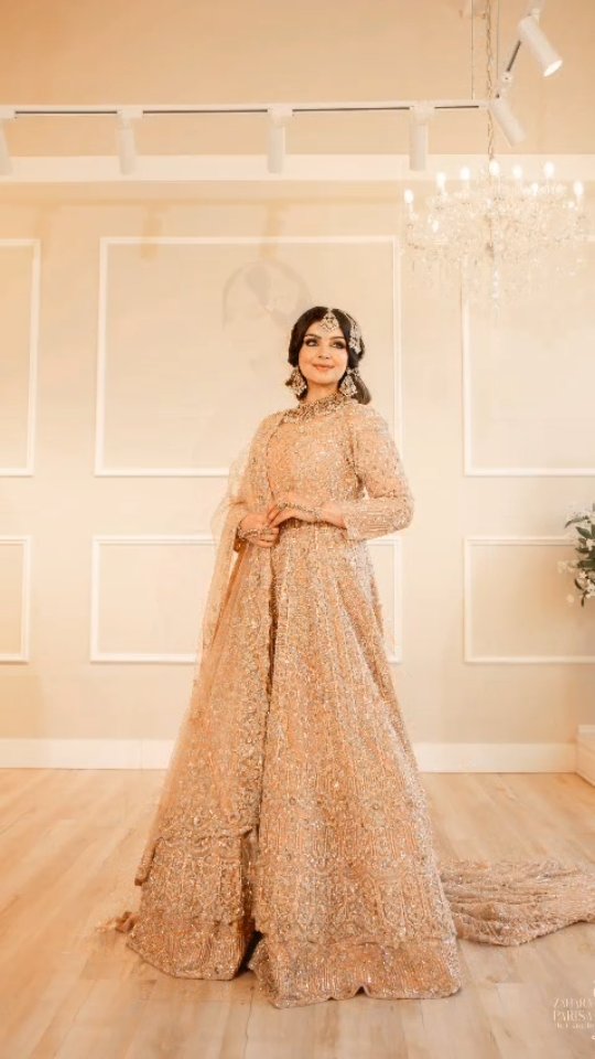 Step into your fairytale with this stunning creation from Dulhan by Raziya. Soft golds, intricate embroidery, and timeless elegance make every moment unforgettable ✨🌸, @zaharaparisa, 