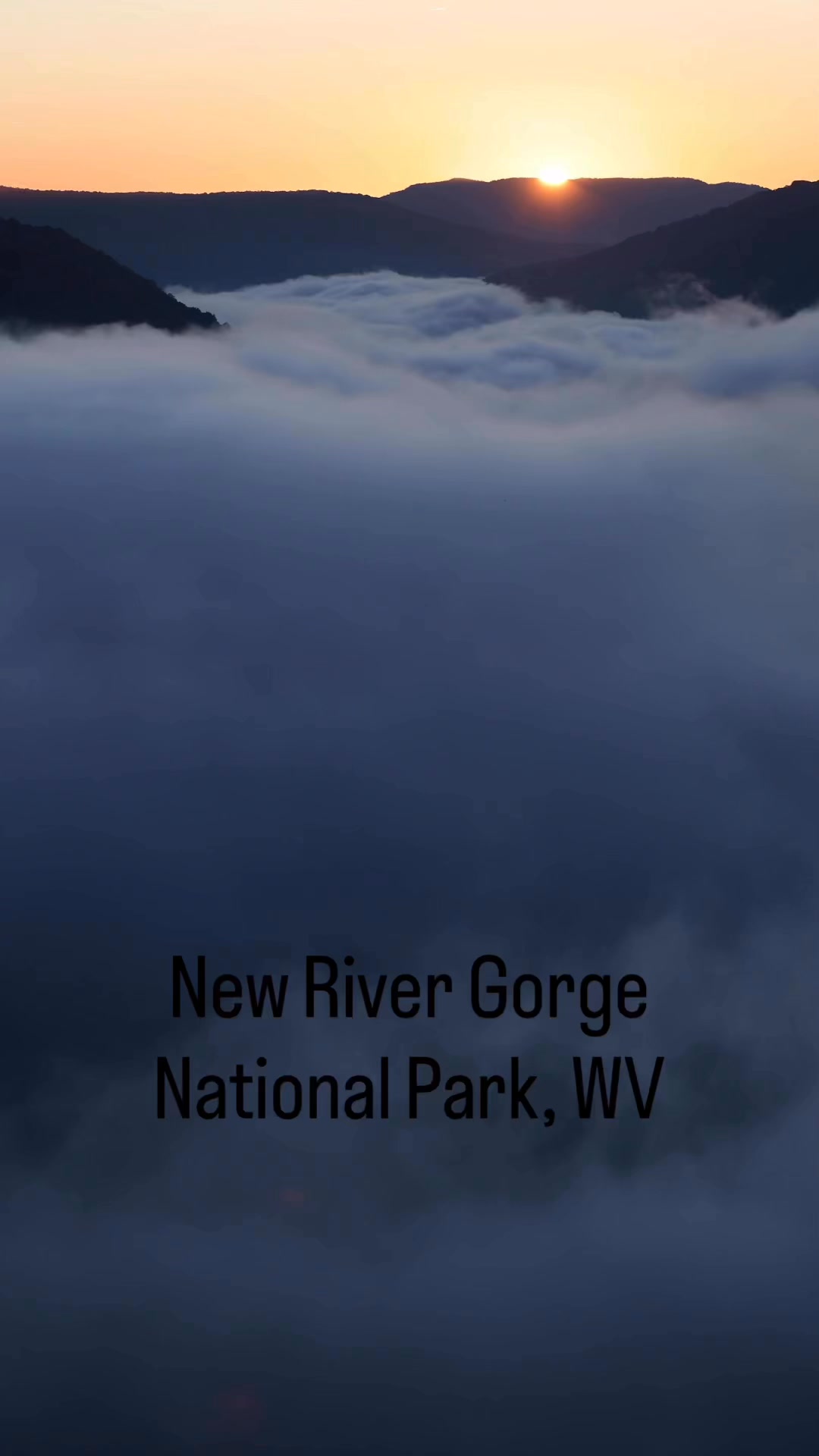 Sun rising over the New River Gorge with fog/clouds dancing. # ...