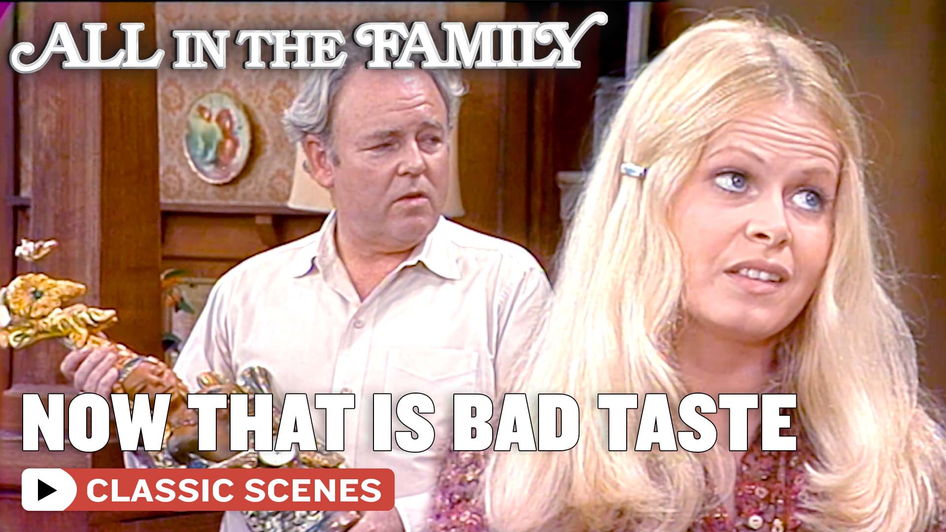 Archie (Carroll O'Connor) buys a gift for Gloria (Sally Struthers) to ...