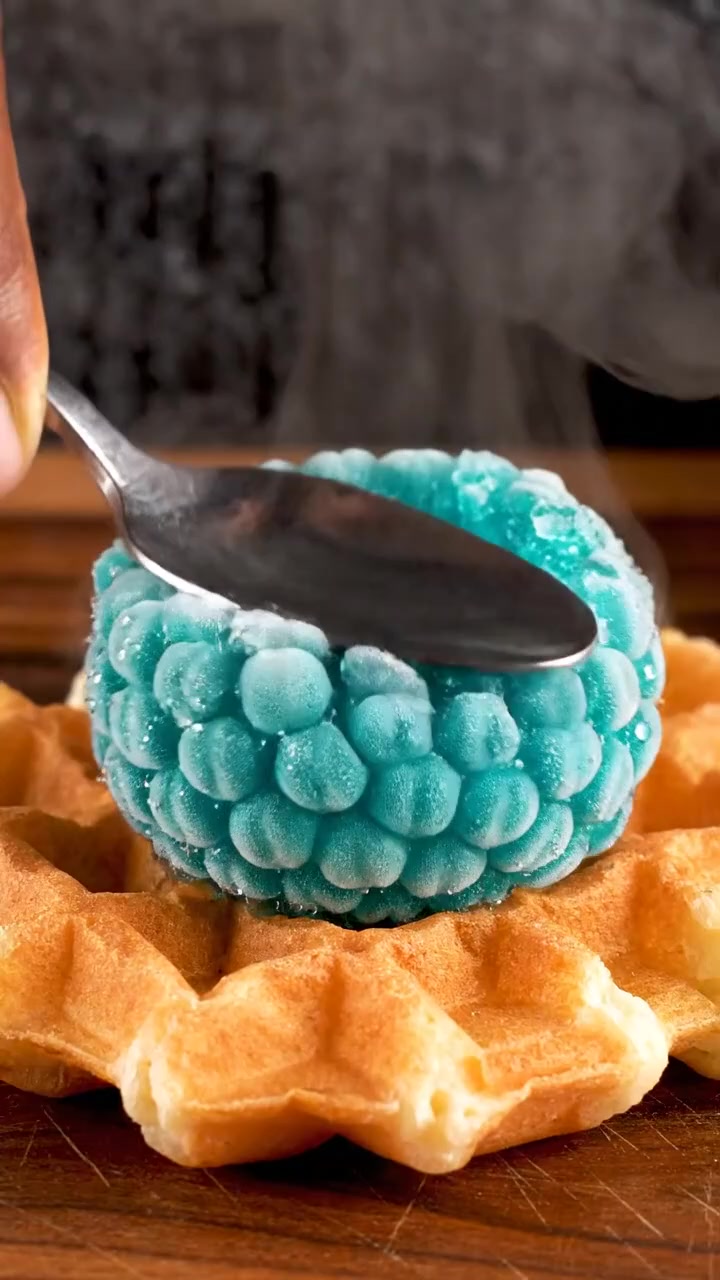 Frozen turquoise raspberry on getting crushed on a waffle looks so cool ...