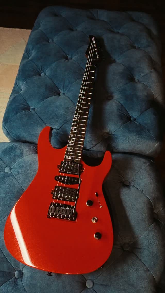 Inspired by the bold red of a Suzuki superbike, this Shue Guitar