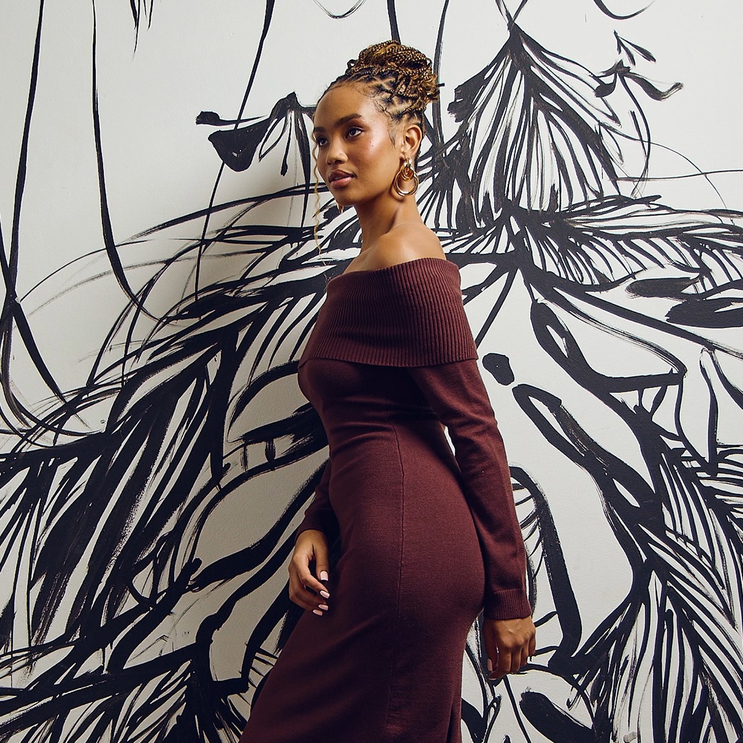 THE KNIT HIT The kind of layering piece that works with winter whites or grounds an all-over look. Think of this dress as your entry point to commitment dressing. Button Through Column