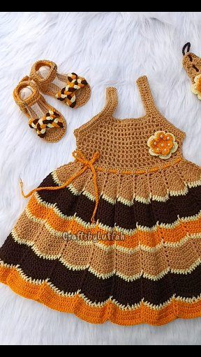 The AURORA Dress in sunflower tones is a Perfect yet simple crochet dress for baby girls , The dress set contains:, 🌼 A singlet-style bodice crochet dress, 🌼 A floral appliqué headband adorned with 